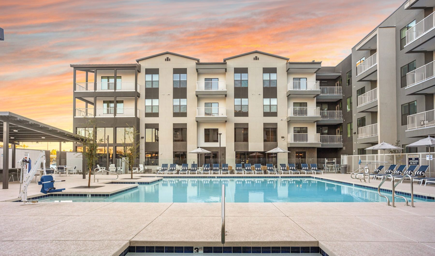 a swimming pool in front of a building